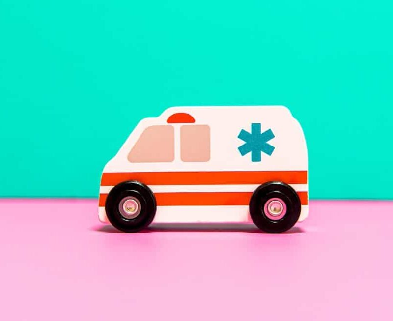 ambulance cartoon on green and pink background