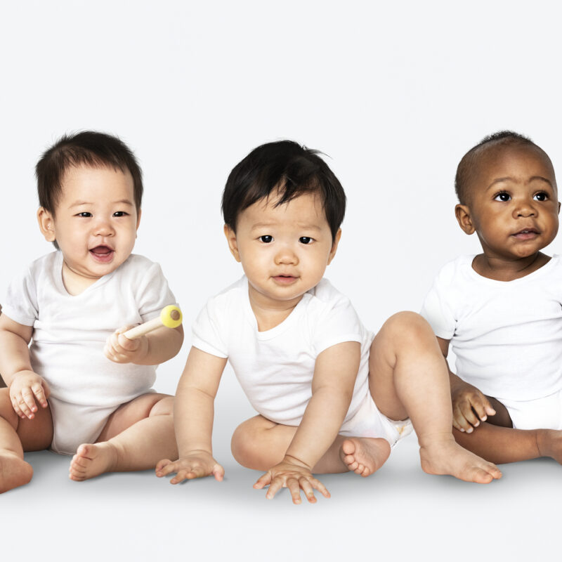 Diverse babies sitting on the floor