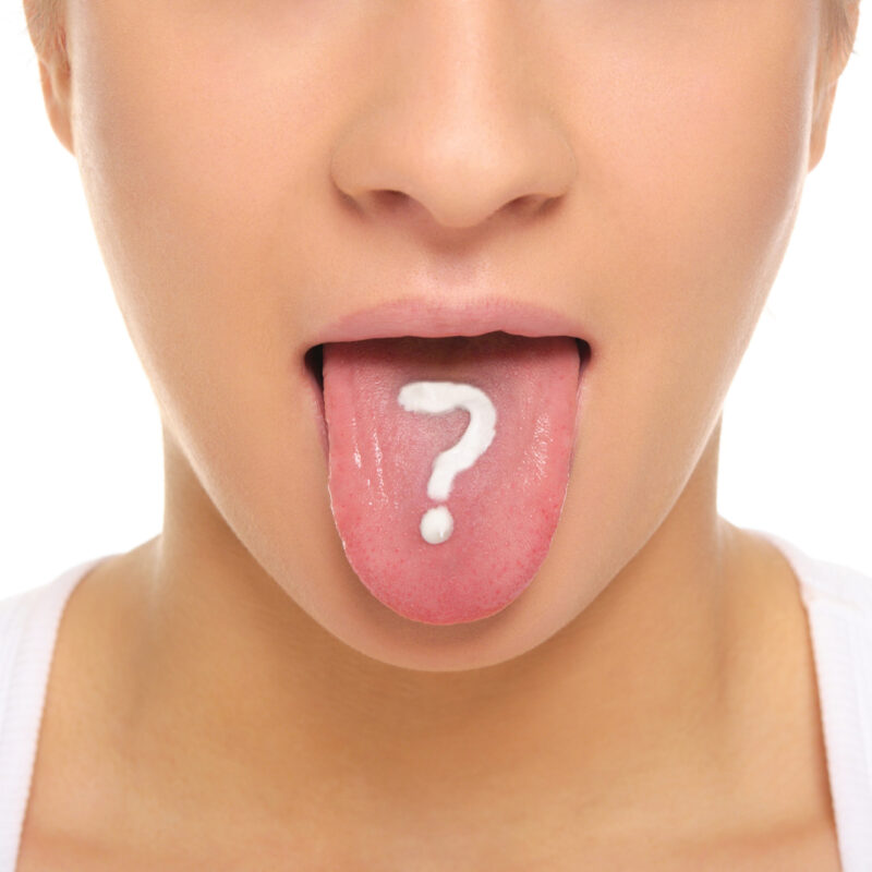 woman sticking out tongue with a white question mark on it