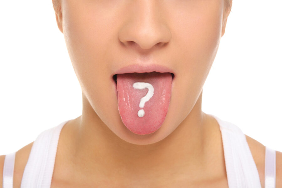 woman sticking out tongue with a white question mark on it