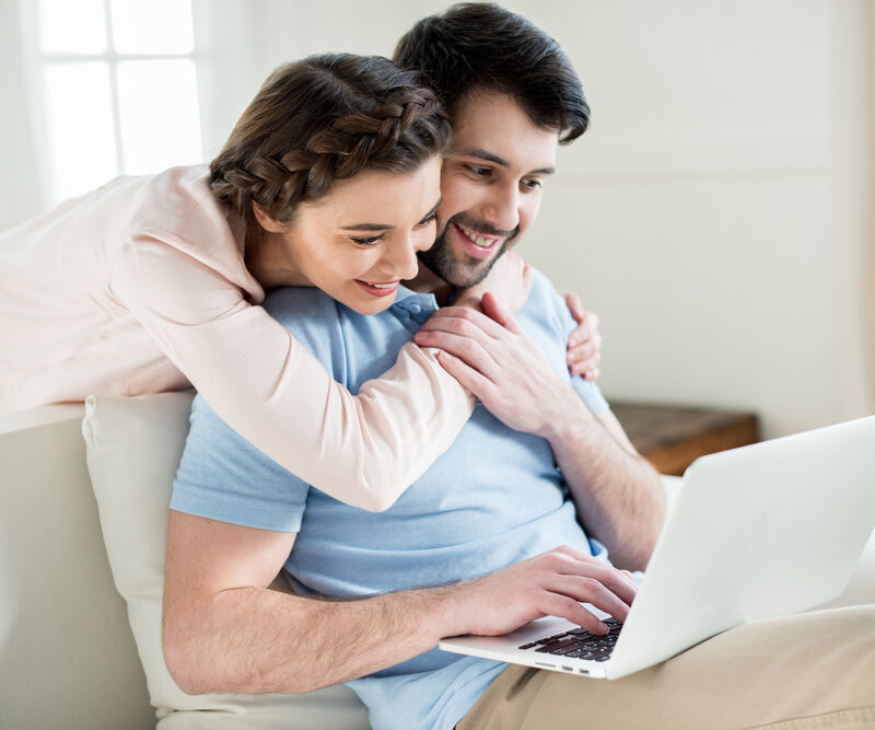 man and woman looking at laptop while changing dentists