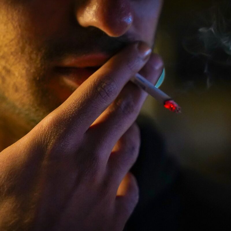 close up of man smoking