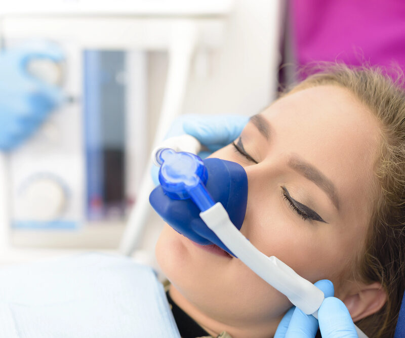woman undergoing sedation at dentist's office