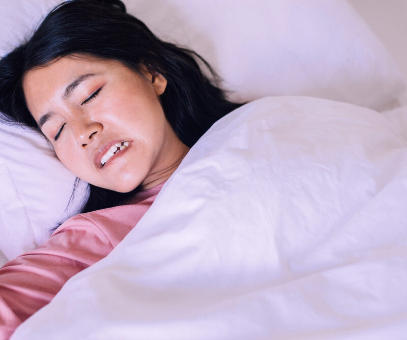woman teeth grinding while sleeping