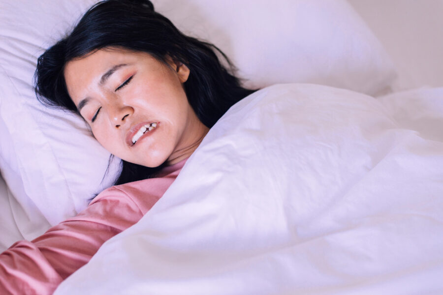 woman teeth grinding while sleeping